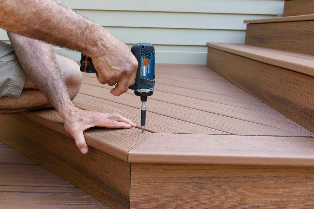 A man performing deck installation services.